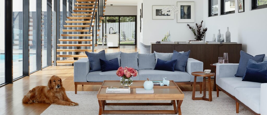 Living room with sofa and table as a home office backdrop