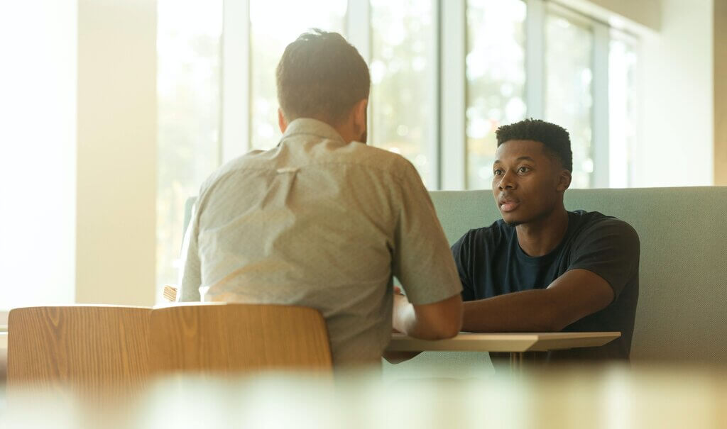 Manager and employee having a one-on-one meeting