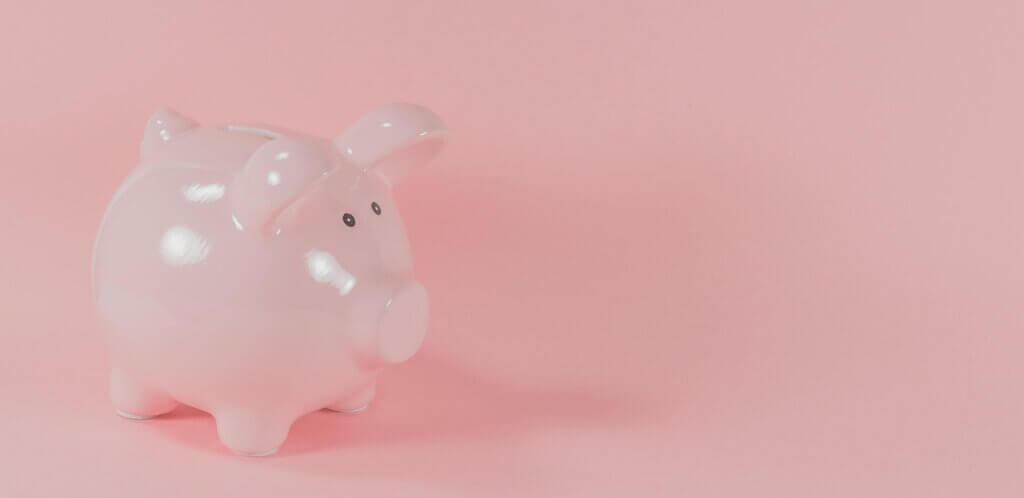 Pink piggy bank representing happy hour fund contributions